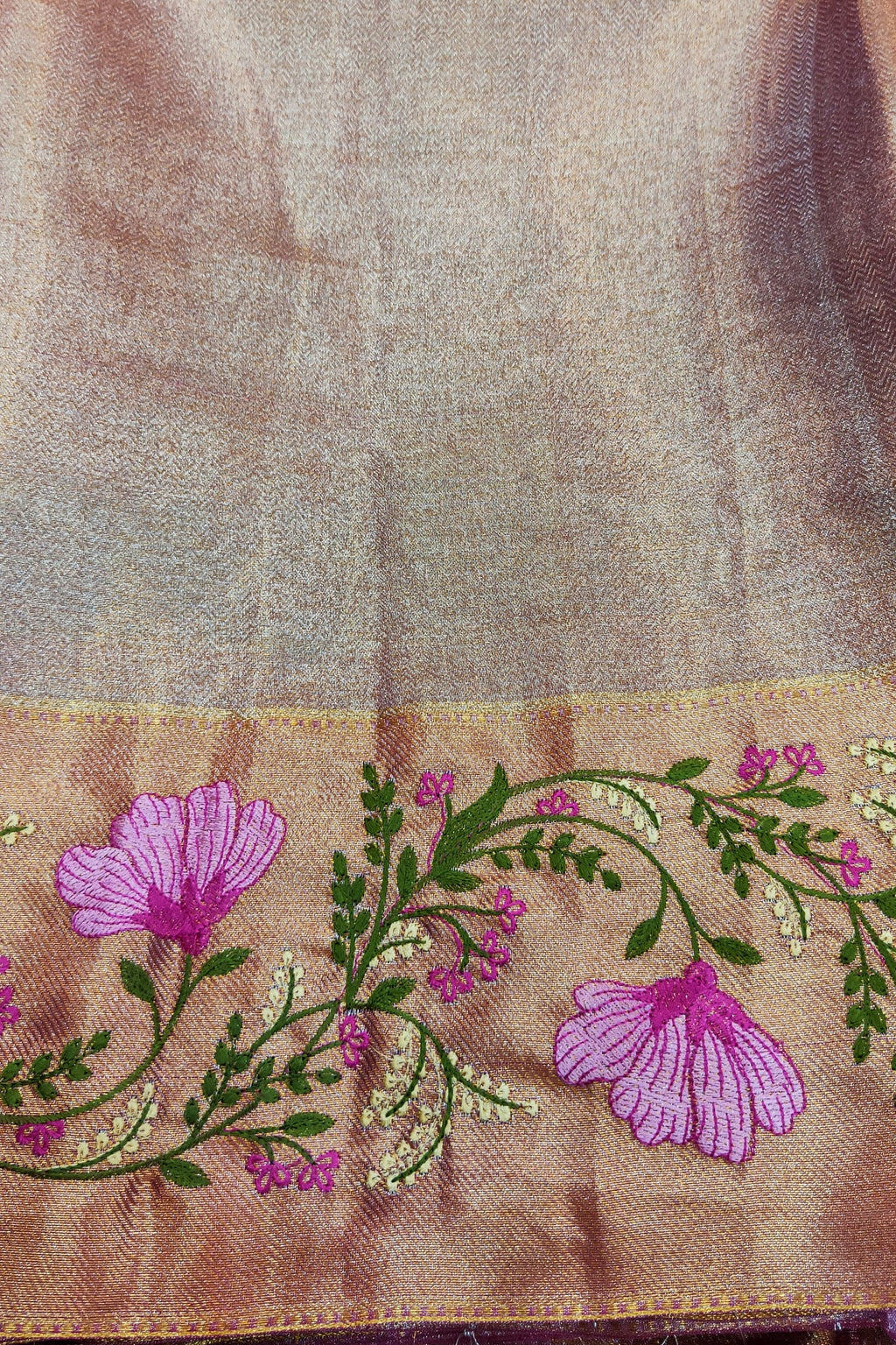 Brown fabric with floral embroidery and pink flowers