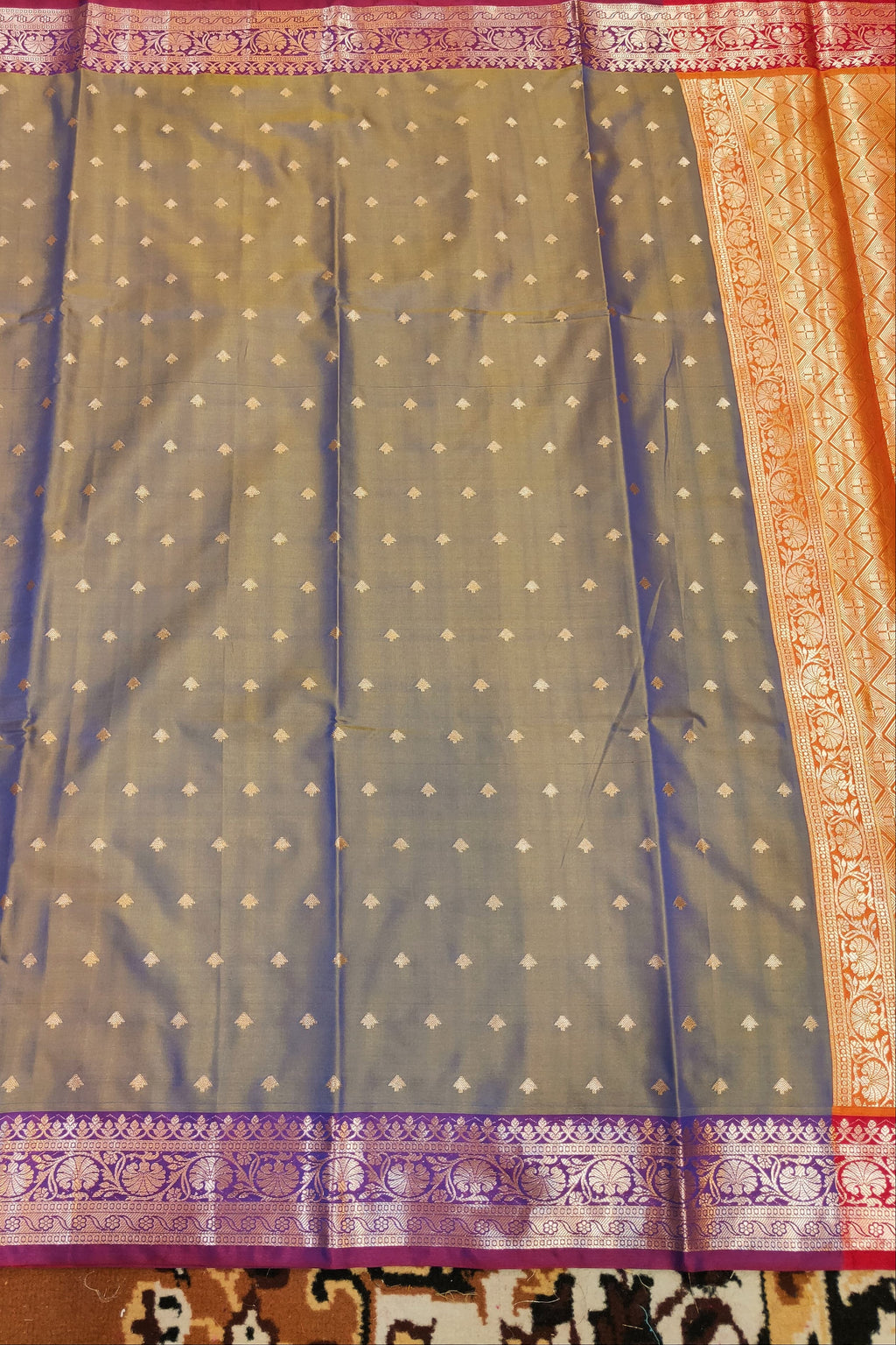 Sari with a patterned border on a textured surface