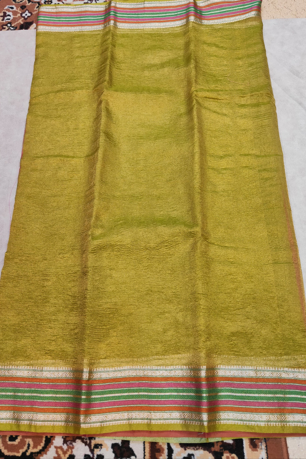 yellow saree on a flat surface