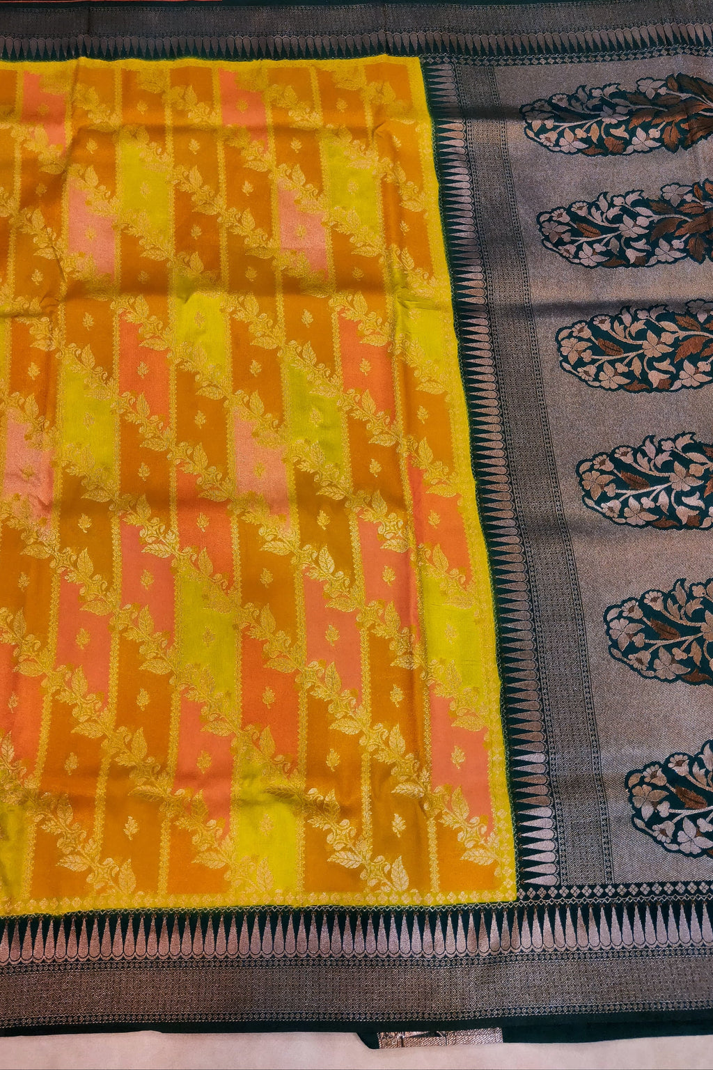 Saree with yellow and pink pattern on a gray background