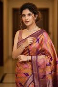 Woman in a colorful saree with a blurred background