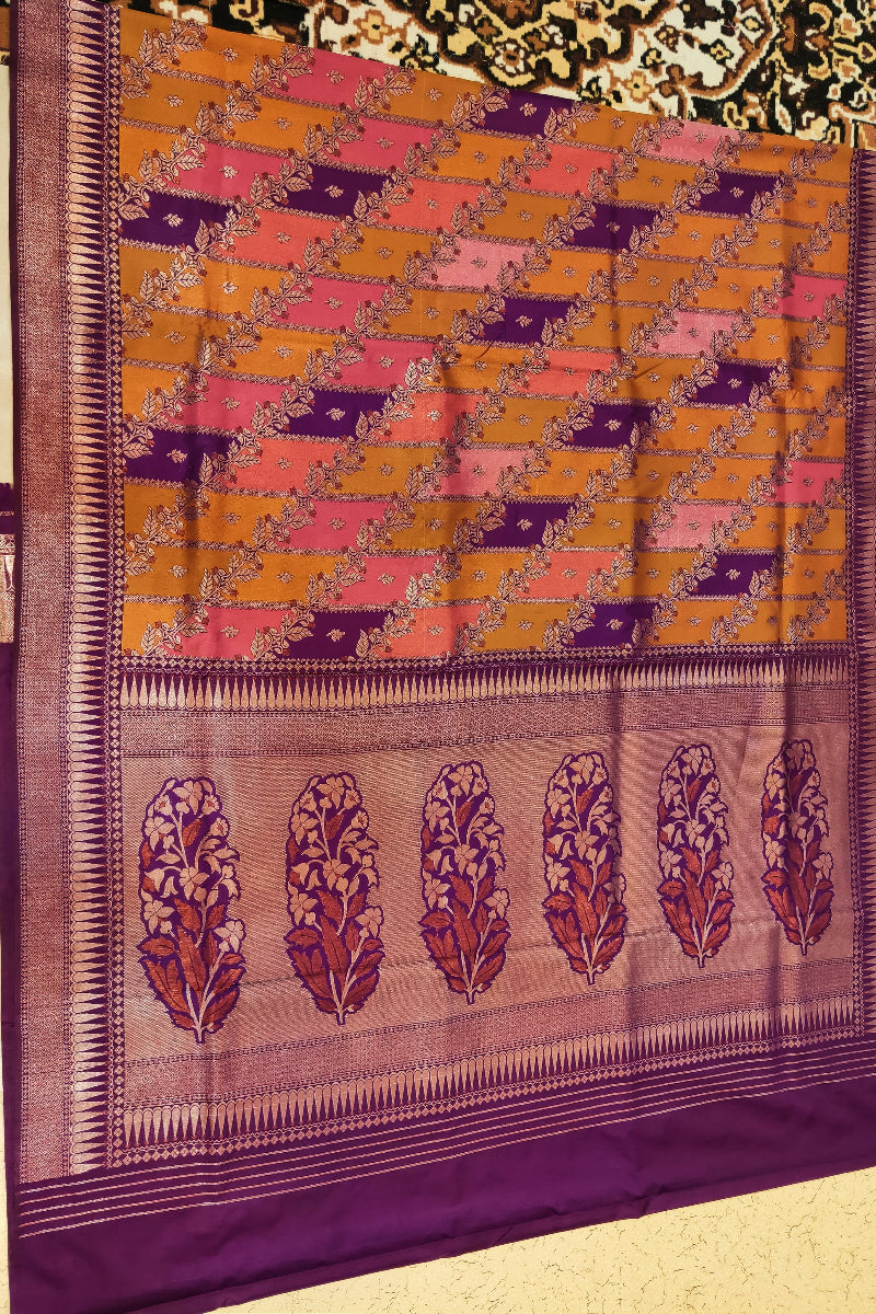 Saree with a checkered pattern in orange and pink on a purple background
