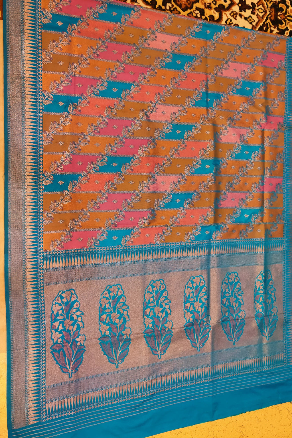 Saree with a colorful pattern on a yellow background