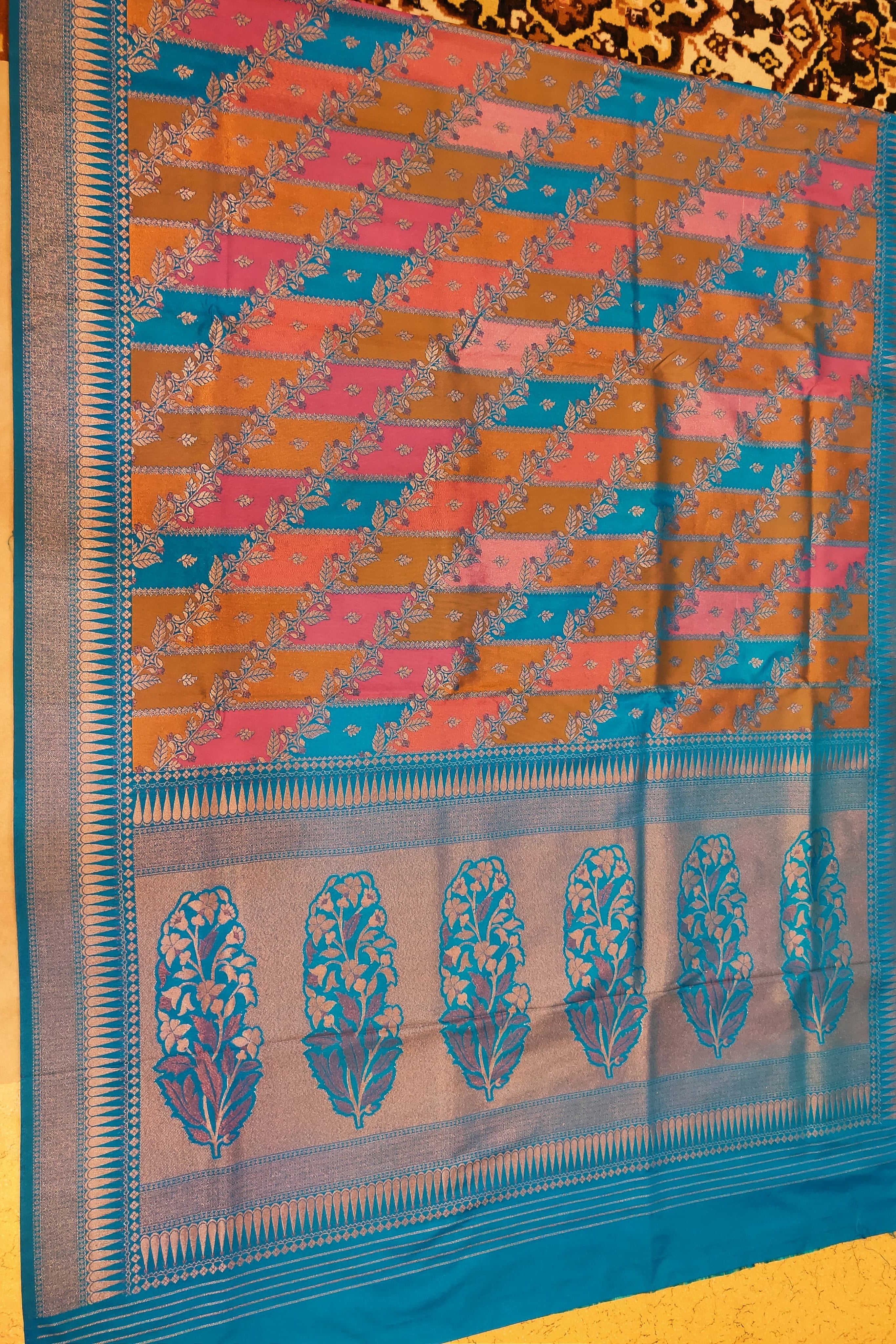 Saree with a colorful pattern on a yellow background