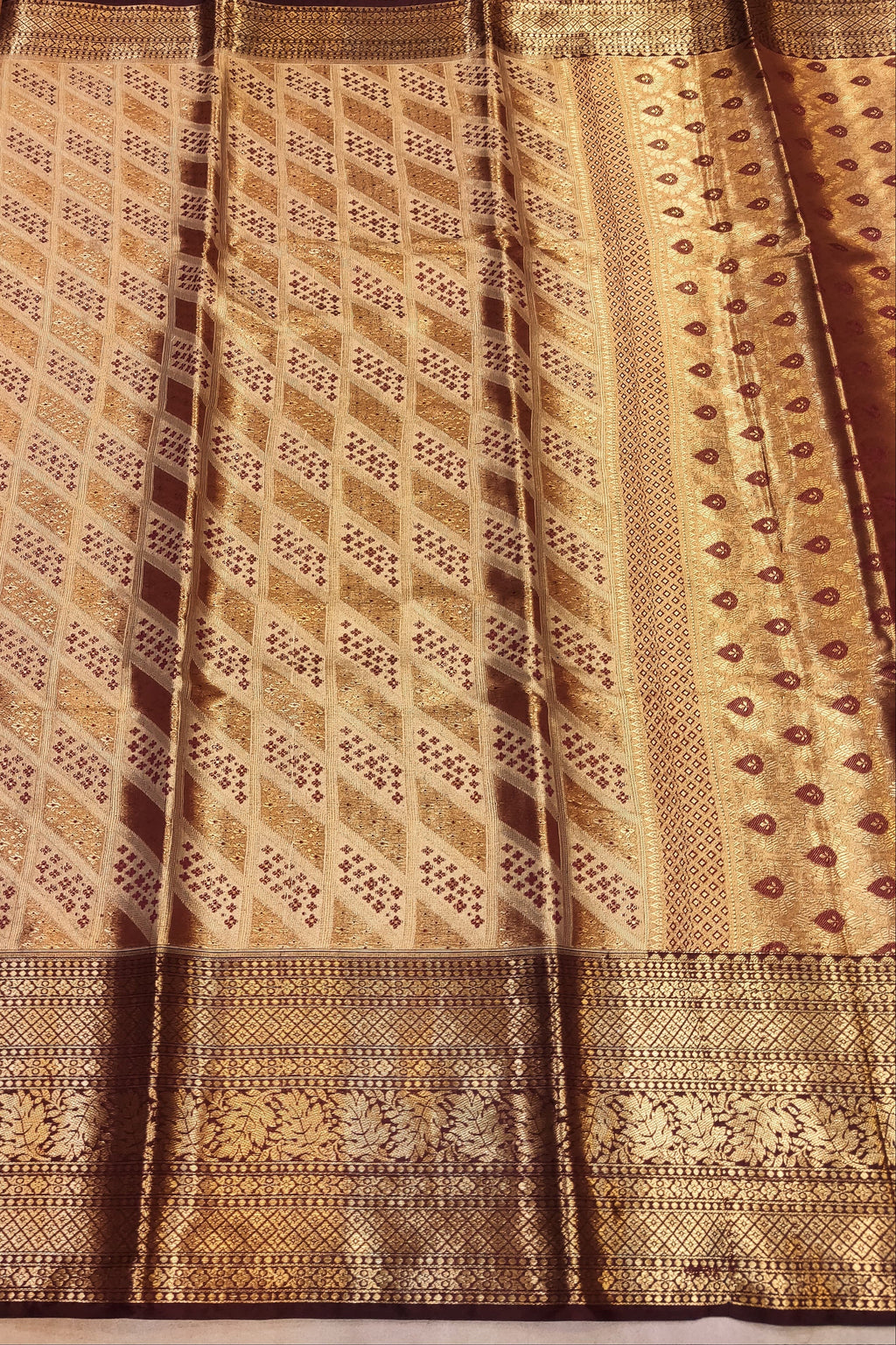 Patterned fabric with brown and beige design on a textured background
