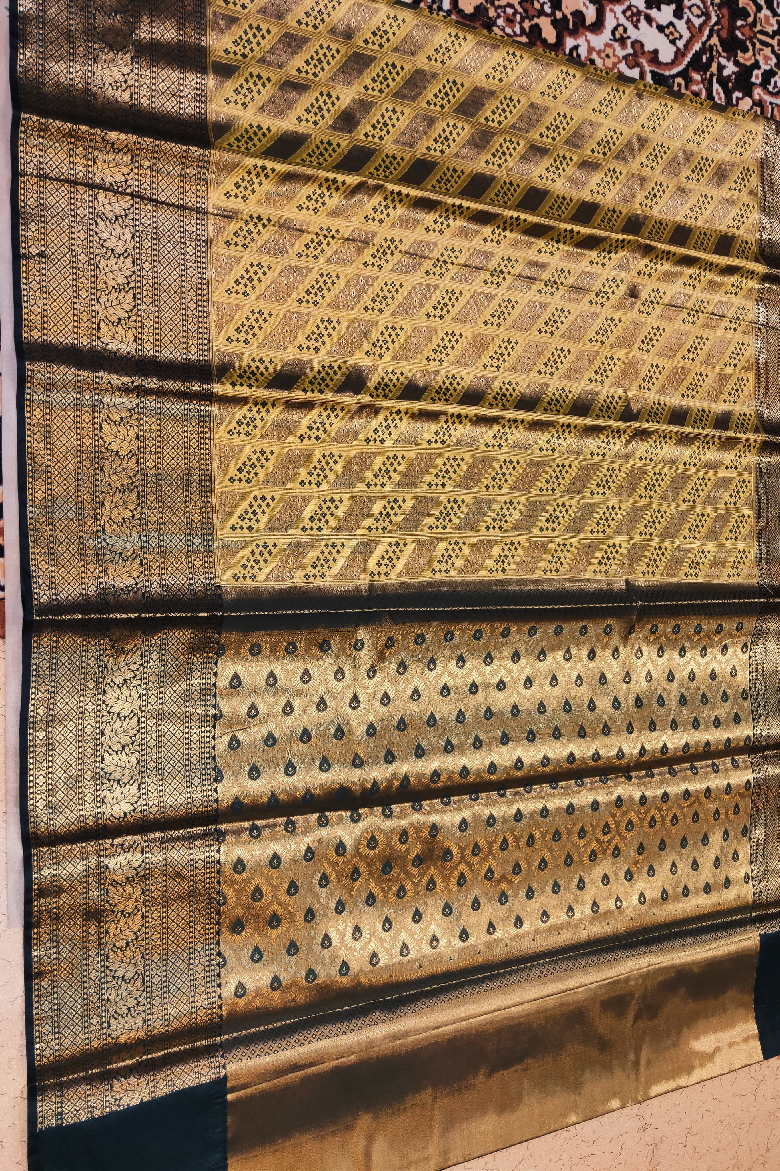 Traditional fabric with intricate patterns on a textured surface