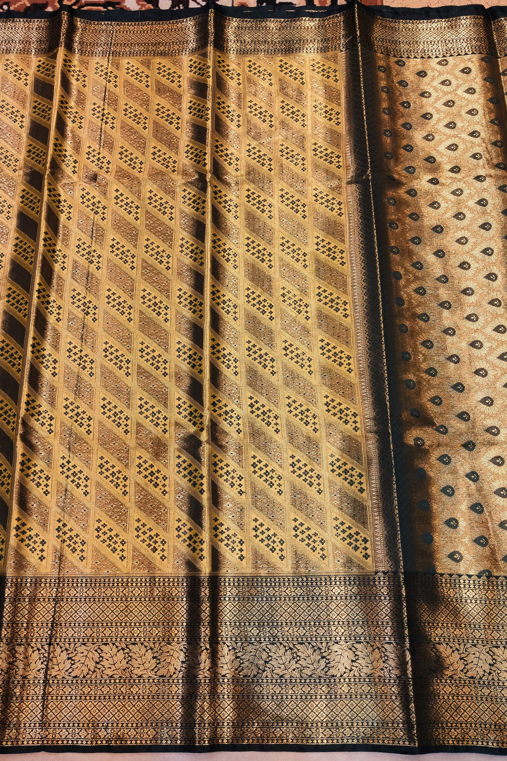 Traditional woven fabric with intricate patterns on a plain background