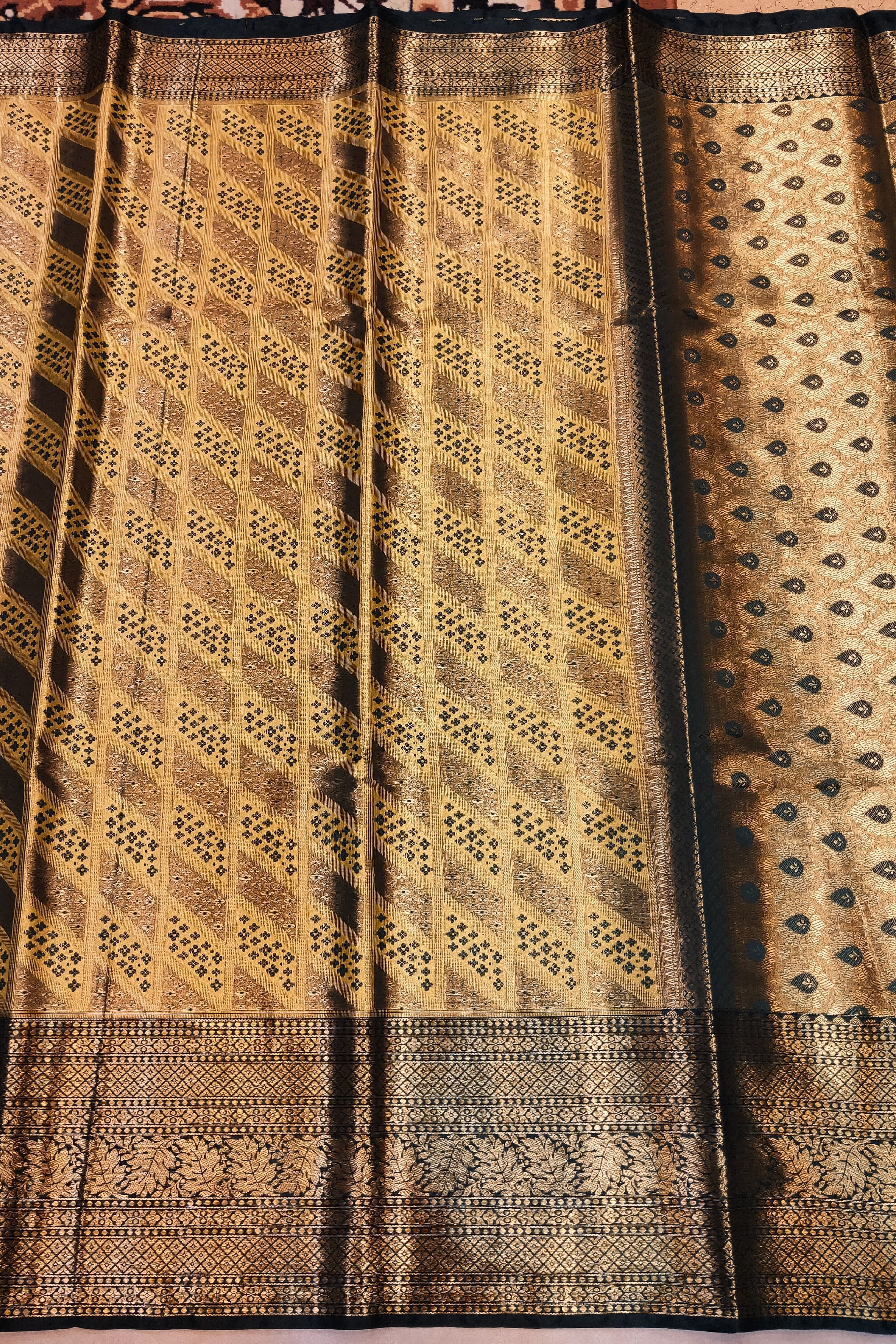 Traditional woven fabric with intricate patterns on a plain background