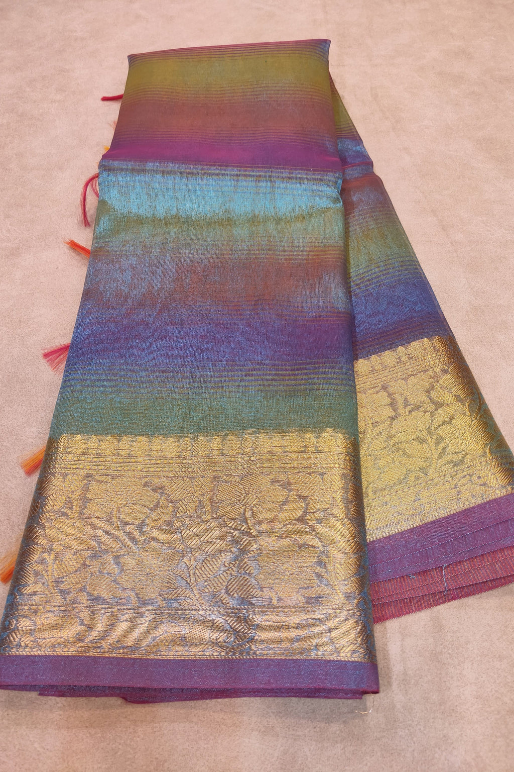 Colorful fabric with intricate patterns on a beige background