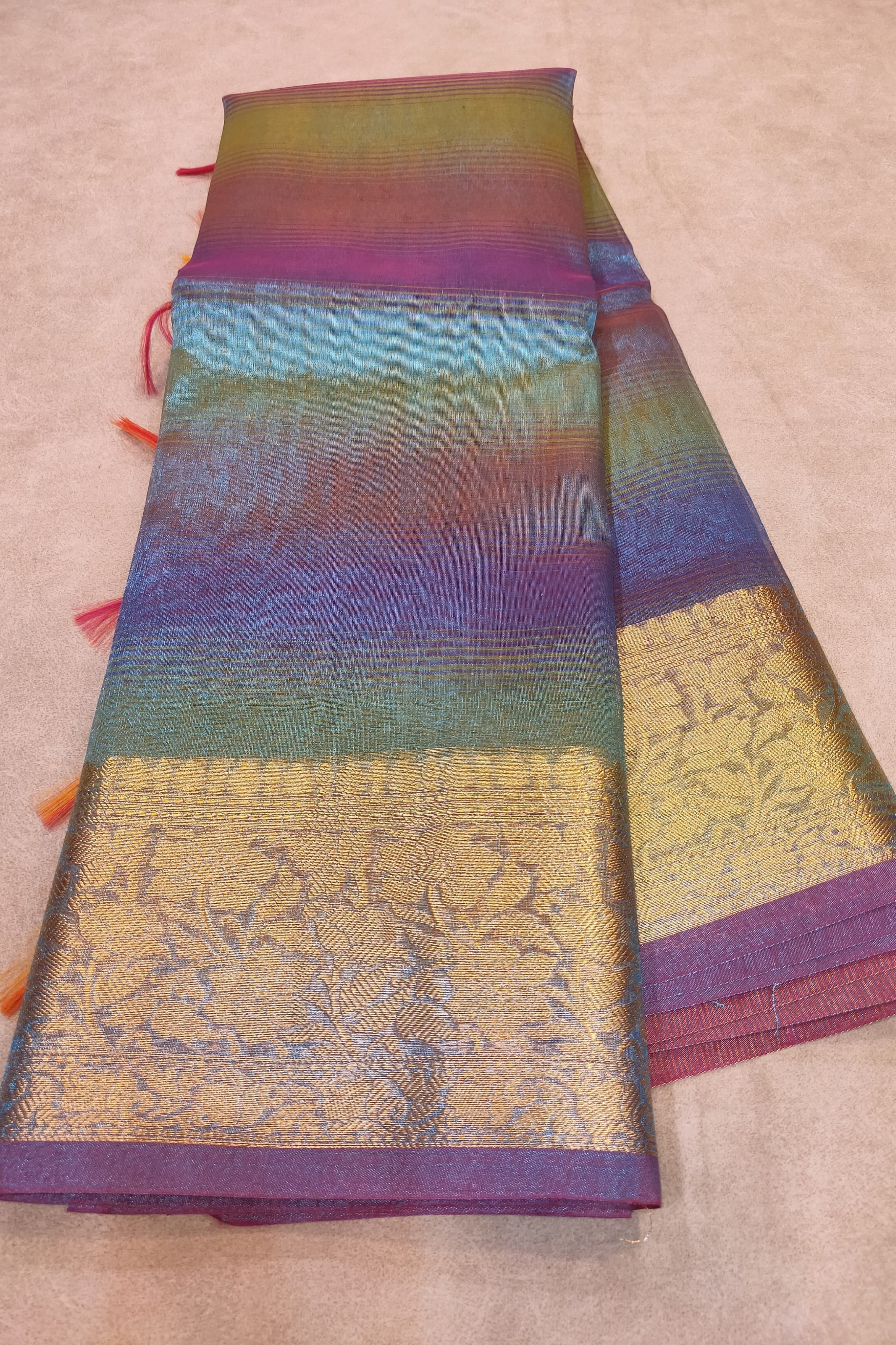 Colorful fabric with intricate patterns on a beige background