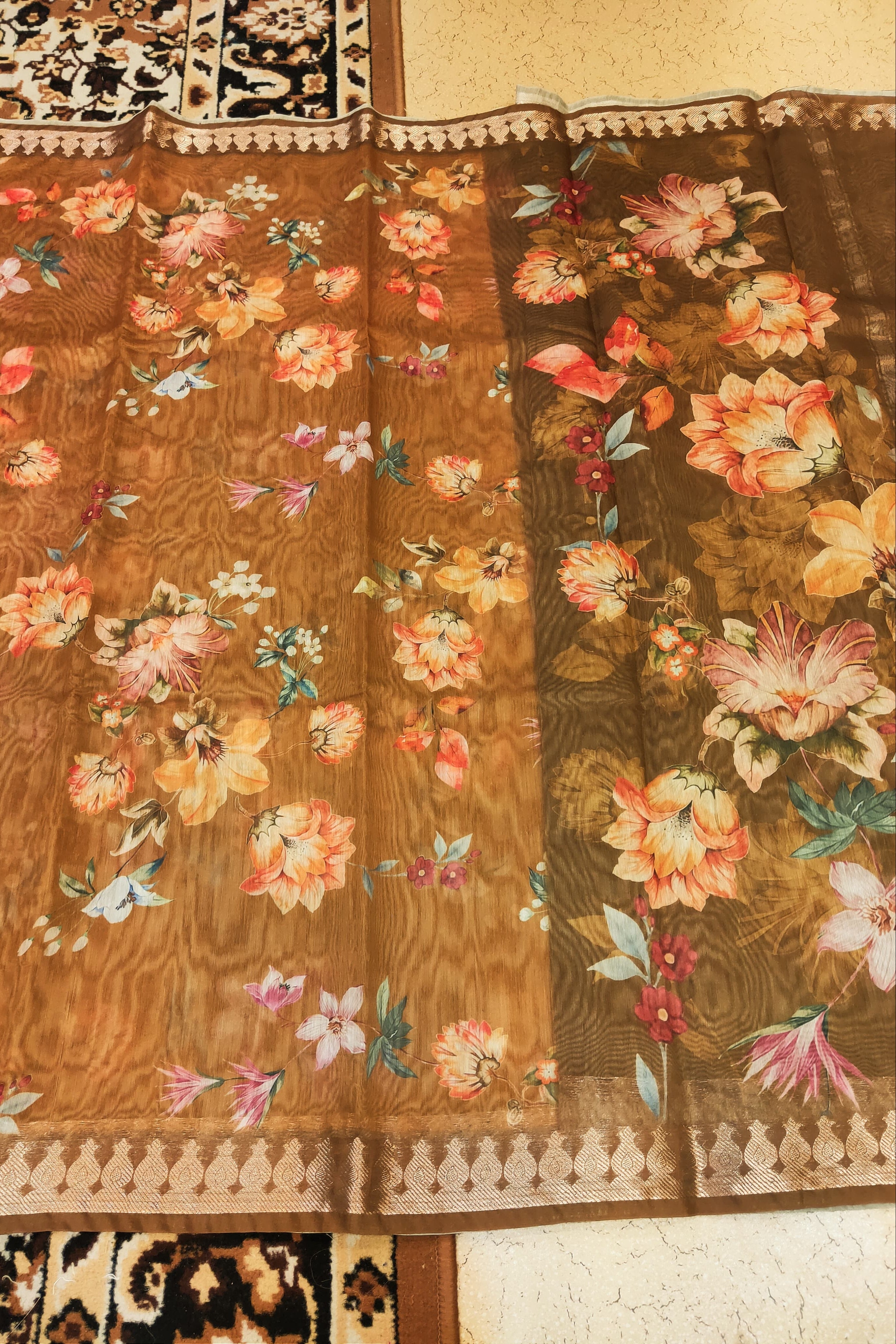 Floral patterned fabric with a brown background