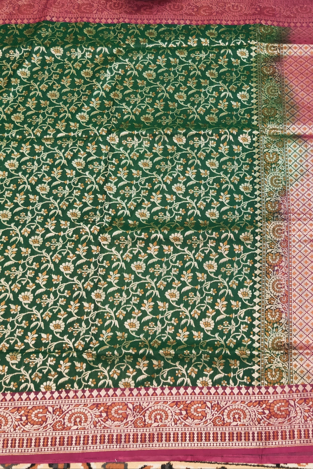Green floral patterned fabric with pink border