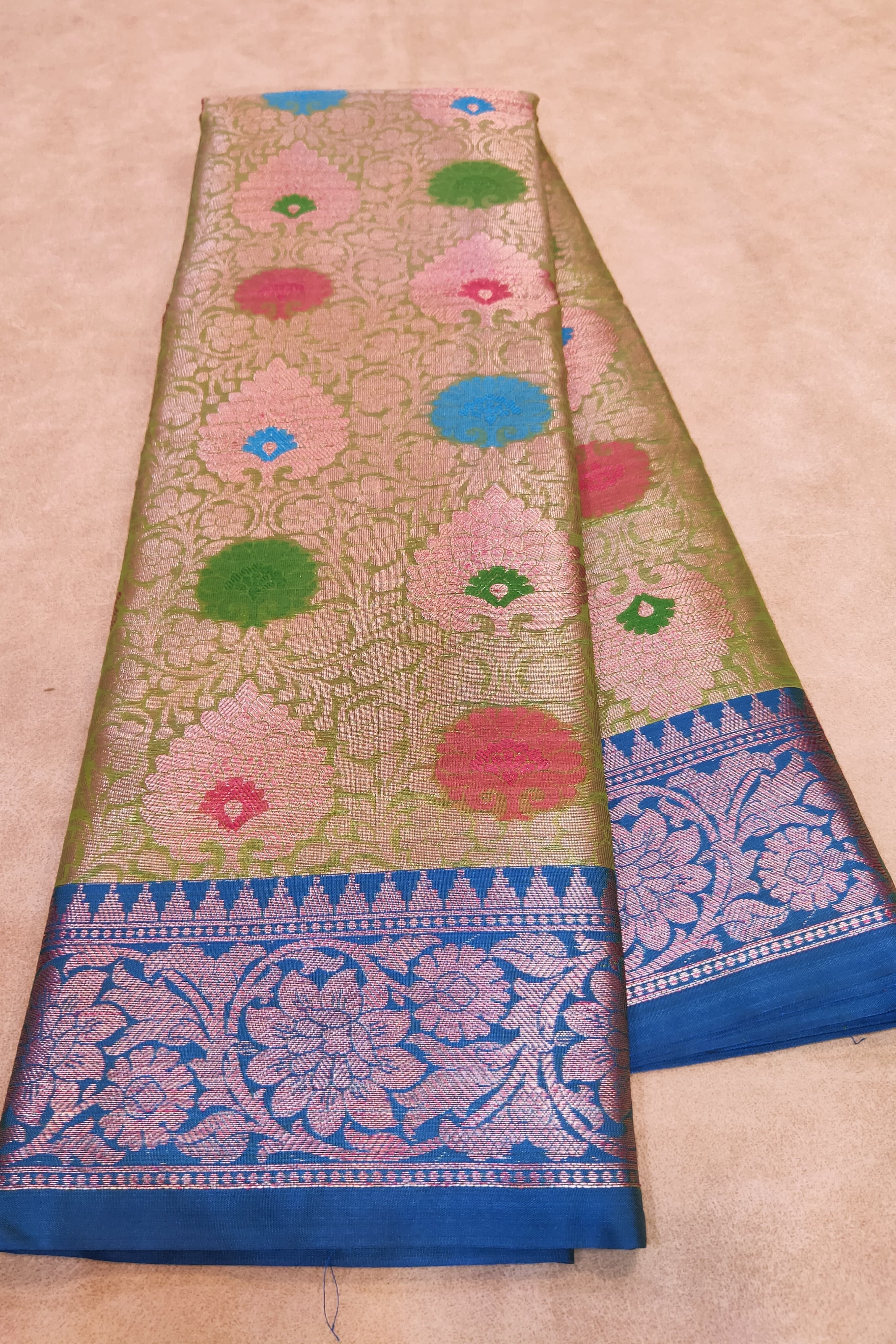 Saree with floral patterns on a beige background