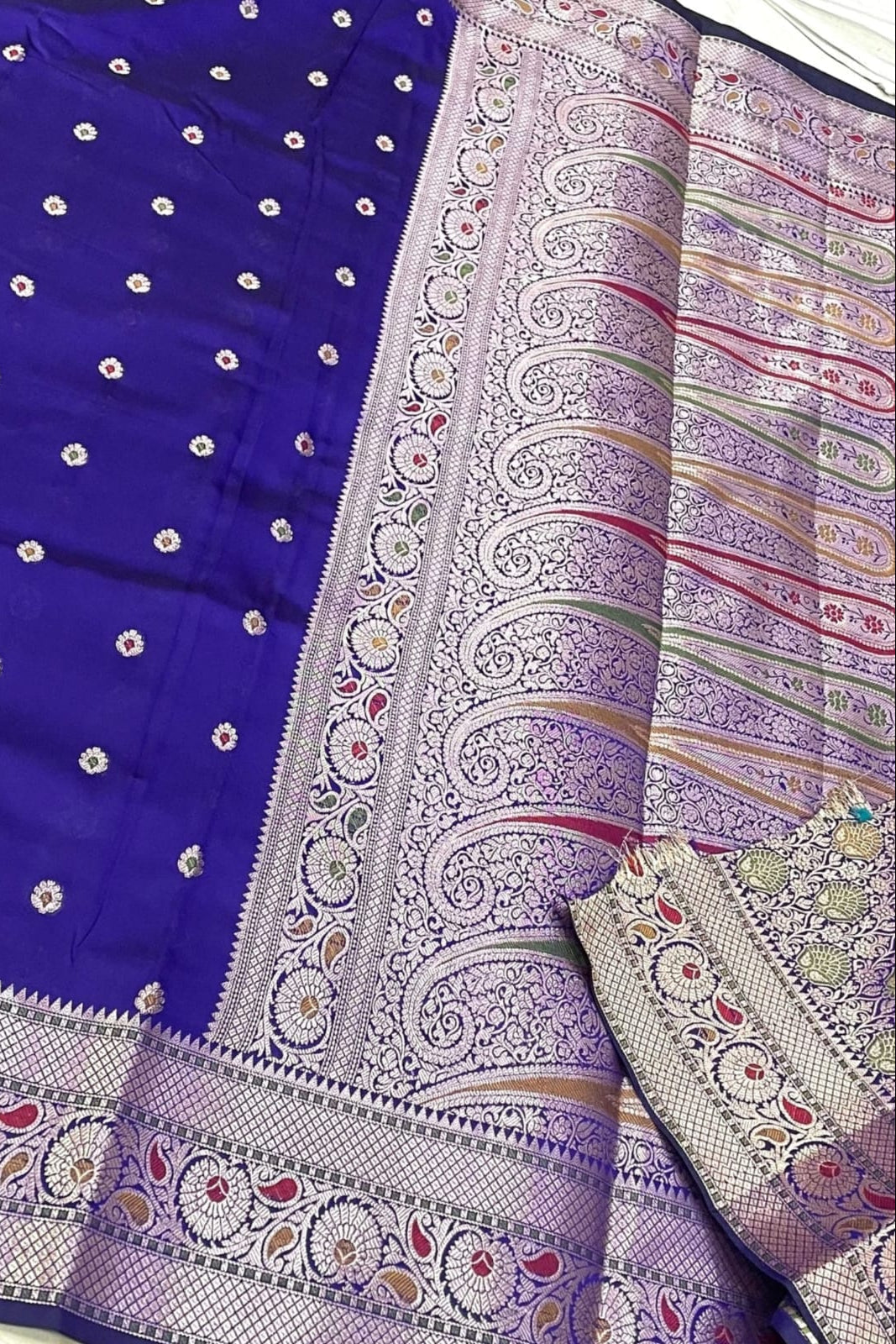 Colorful traditional fabric with intricate patterns and embroidery.