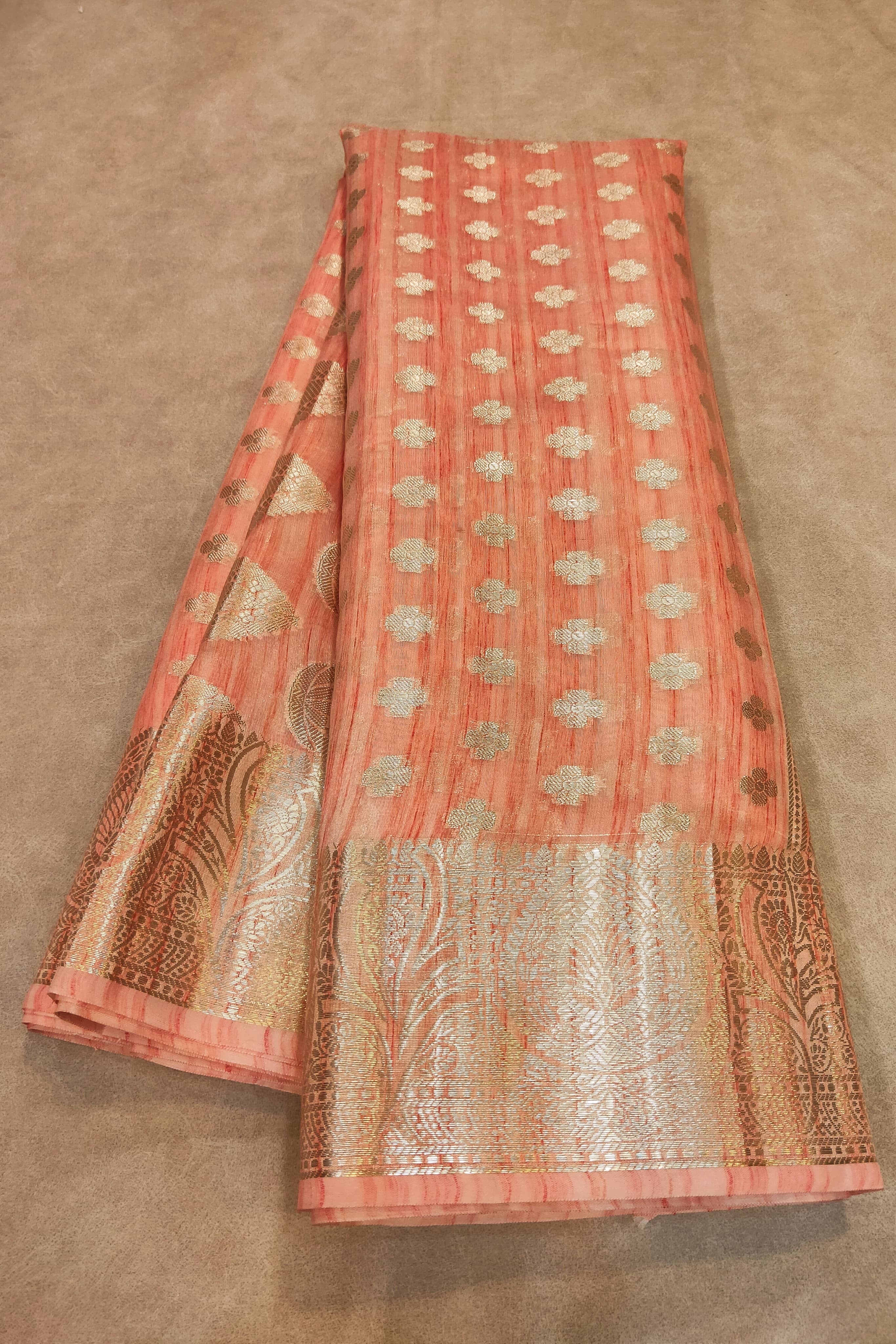Decorative fabric with intricate patterns on a beige background