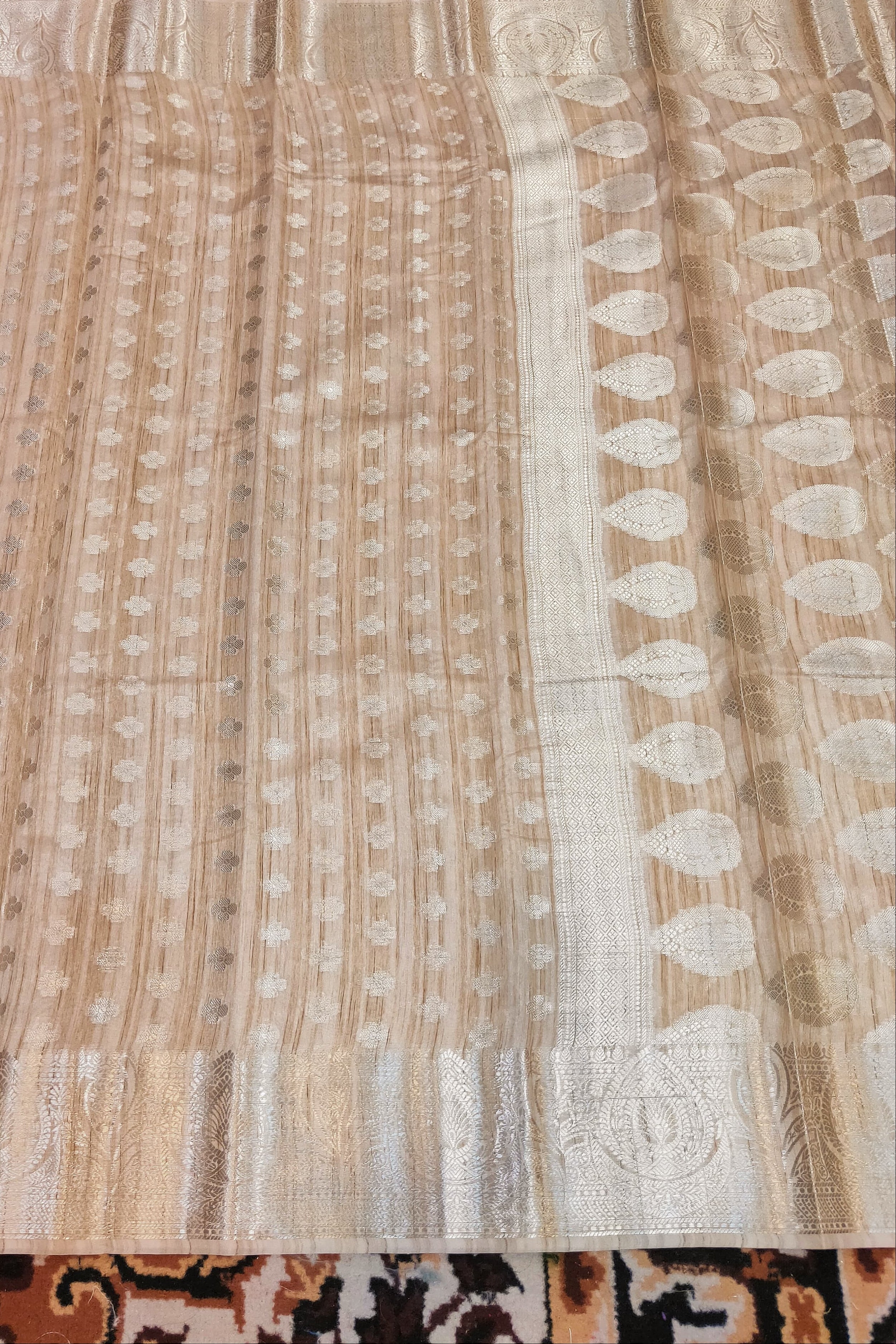 Textured fabric with a pattern on a carpeted floor